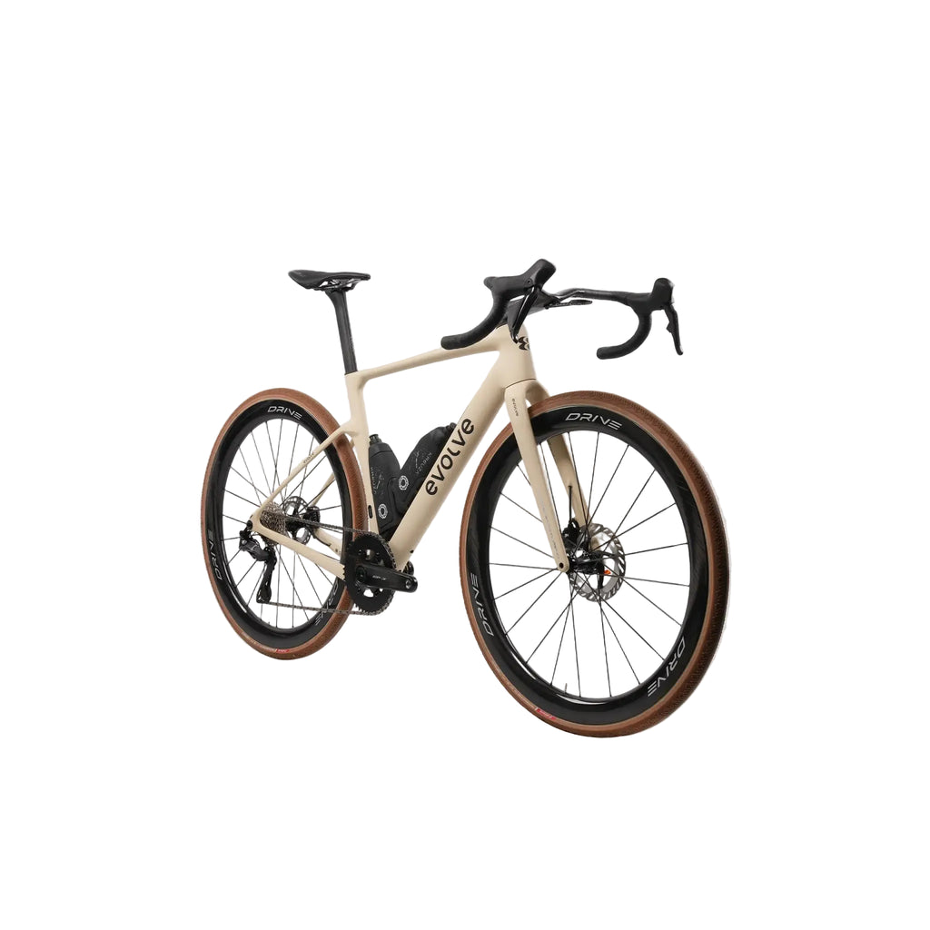 A road bicycle with a cream-colored frame, black components, and brown sidewall tires, shown on a light gray background.