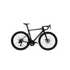 A black road bicycle with drop handlebars and disc brakes, shown in profile against a light gray background. The brand name 'SCORPA' is visible in gold lettering on the down tube.
