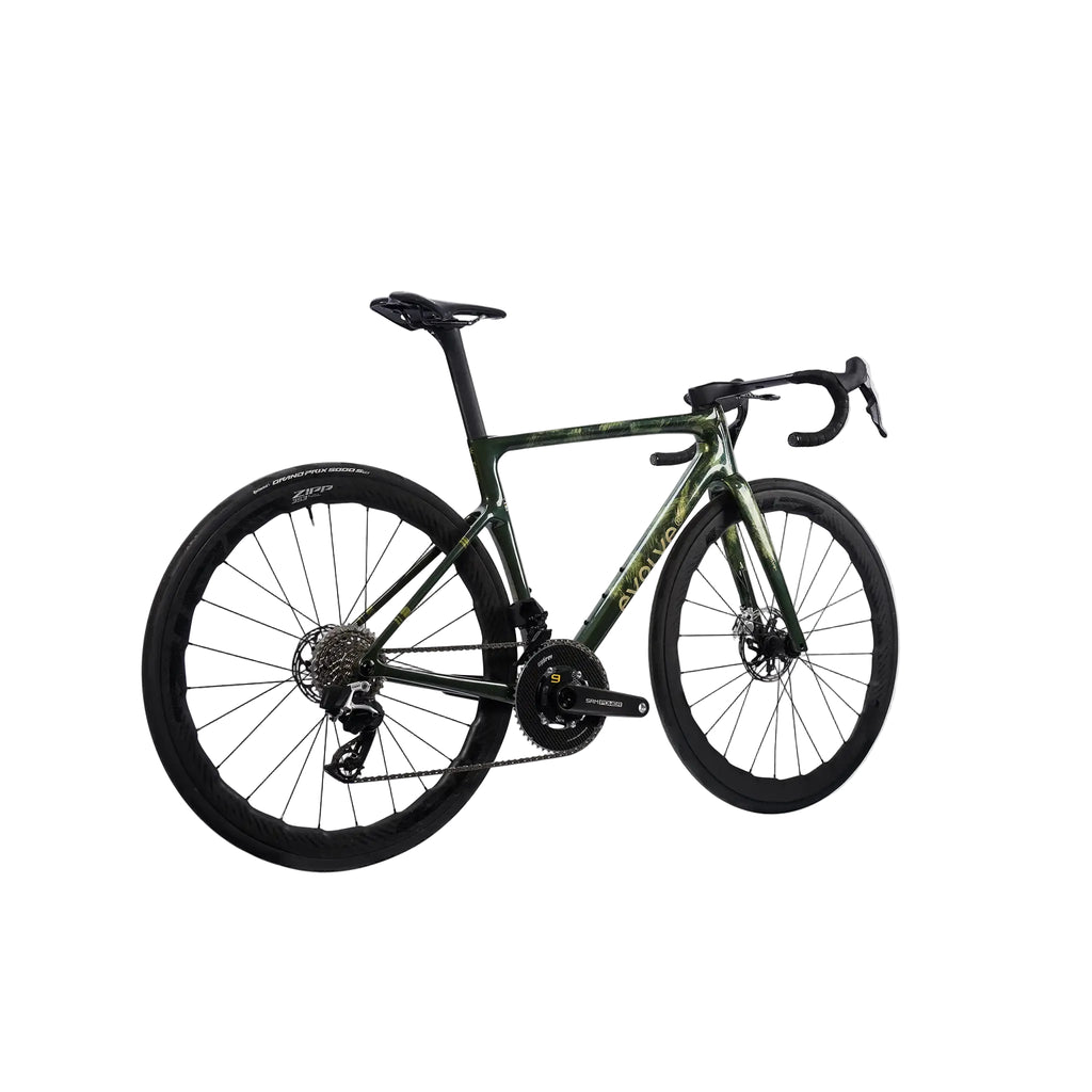 A carbon fiber road bicycle with a dark green and black camouflage pattern frame, black wheels, and black components, shown from a side profile on a light gray background.