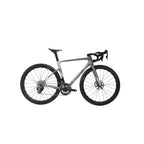 A road bicycle with a matte gray frame and black components, including the wheels, tires, saddle, and handlebars, shown against a light gray background.