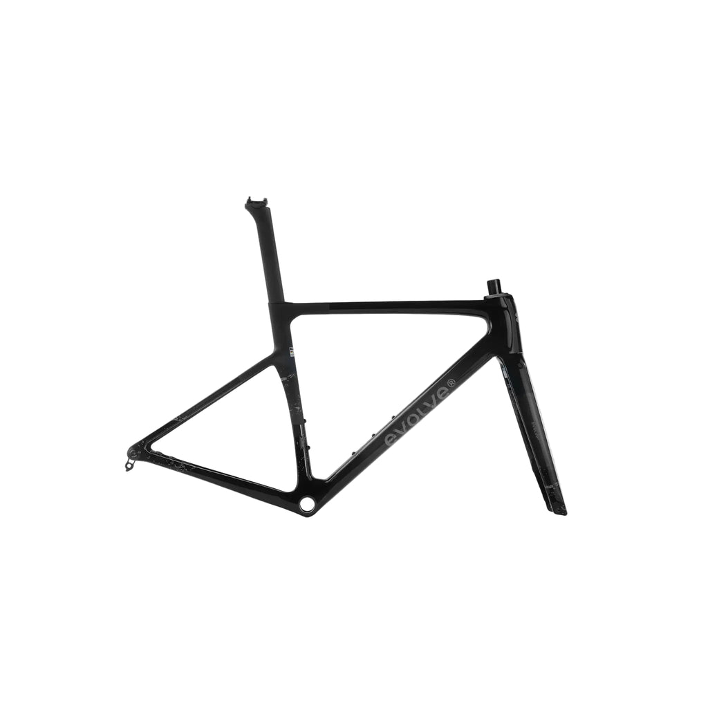 A black carbon fiber road bicycle frame, shown from a side profile view against a light gray studio background. The brand name 'EVOLVE' is printed in white on the down tube.