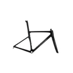 A black carbon fiber road bicycle frame, shown from a side profile view against a light gray studio background. The brand name 'EVOLVE' is printed in white on the down tube.