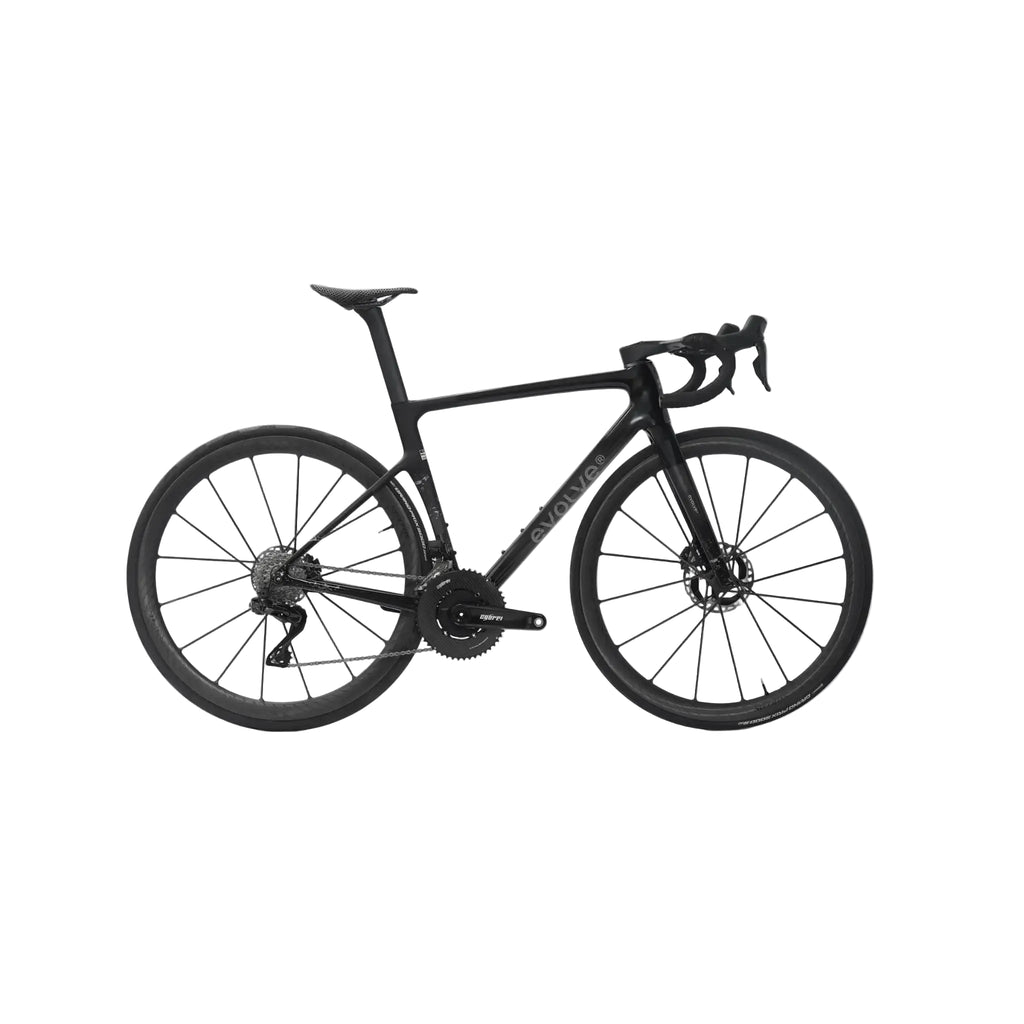 A black road bicycle with drop handlebars, disc brakes, and a sleek carbon fiber frame, shown from a side profile against a light gray background.