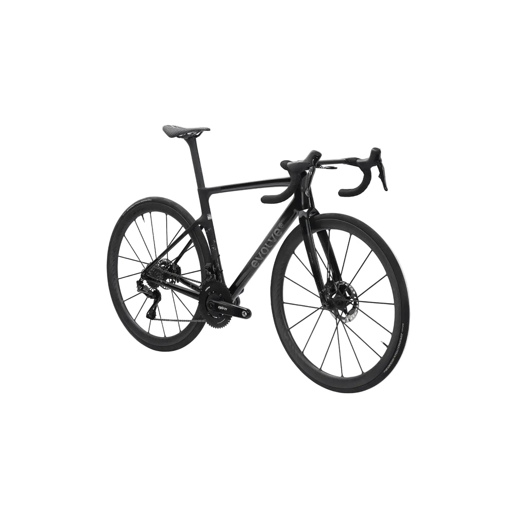 A black carbon fiber road bicycle with drop handlebars and disc brakes, shown from a three-quarters angle against a light gray background.