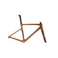 A carbon fiber bicycle frame in a matte copper-orange finish with dark purple and red gradient accents near the fork and seat tube, featuring the 'evolve' brand name on the down tube.