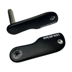Two black bicycle crank arms with silver bolts and a silver hex key, shown on a light gray background. One crank arm has 'OVERFAST' printed on it in white.