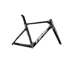 A black carbon fiber road bicycle frame with the brand name 'TIME' in white on the down tube, shown against a dark gray studio background.